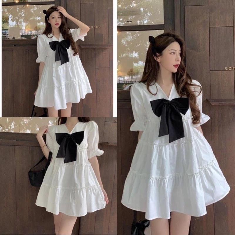 Đầm babydoll nữ ,đầm xoè cổ V đính nơ dáng ngắn mày trắng ,chất voan mềm xếp tầng, đầm trắng, đầm tiểu thư