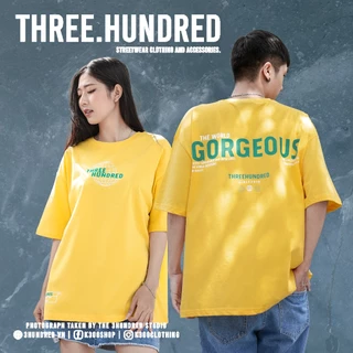 Áo Thun Vàng In Chữ The World Gorgeous Màu Xanh Chất Liệu 100% Cotton Form Rộng Thoải Mái Unisex Nam Nữ