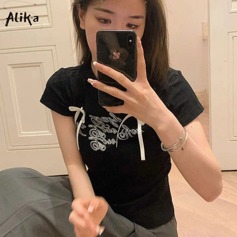 Áo thun nữ Alika tay ngắn y2k Nhật Bản ngọt ngào phong cách bm Hàn Quốc thiết kế in chữ nơ đa năng slim top