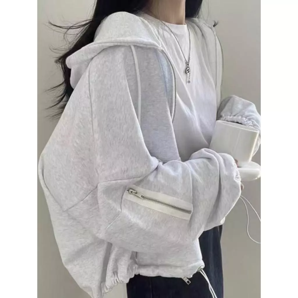 Áo hoodie nữ dáng ngắn croptop của 2025-2026 với túi khóa tay, dây rút gấu, chất vải nỉ bông dày ấm đẹp