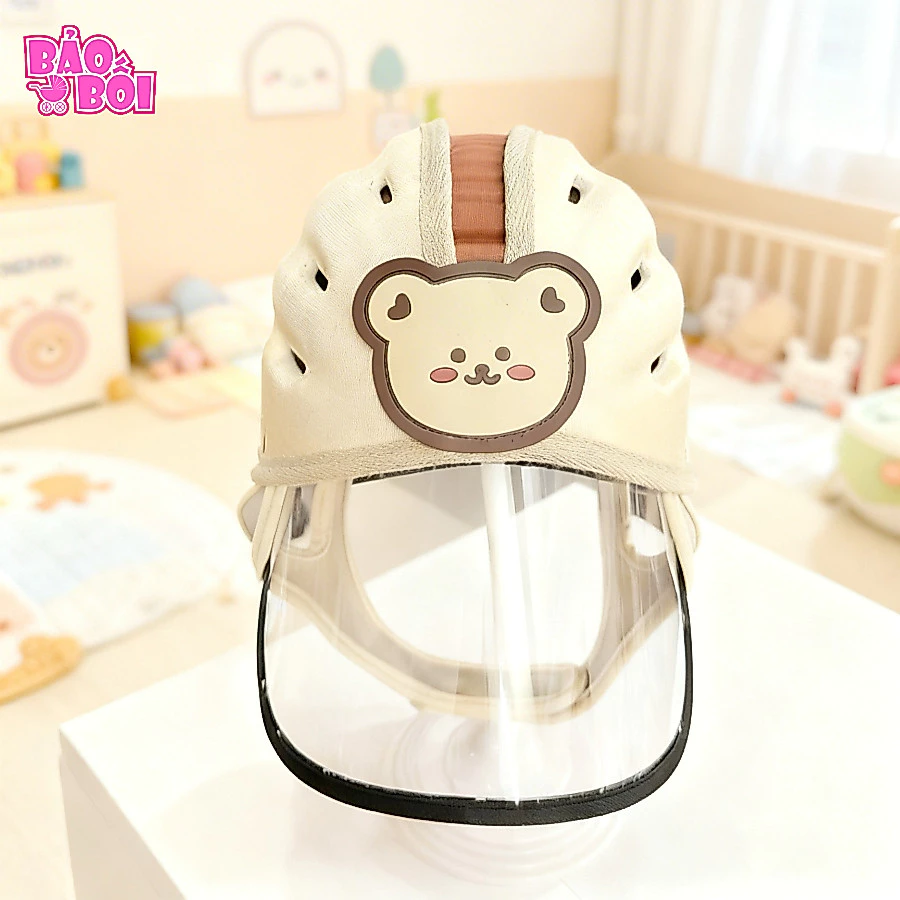 Mũ bảo vệ đầu có kính chắn bui, chắn gió cho bé tập đi xe máy, kính tháo rời được đang được đối chiếu cho người mua tại Việt Nam