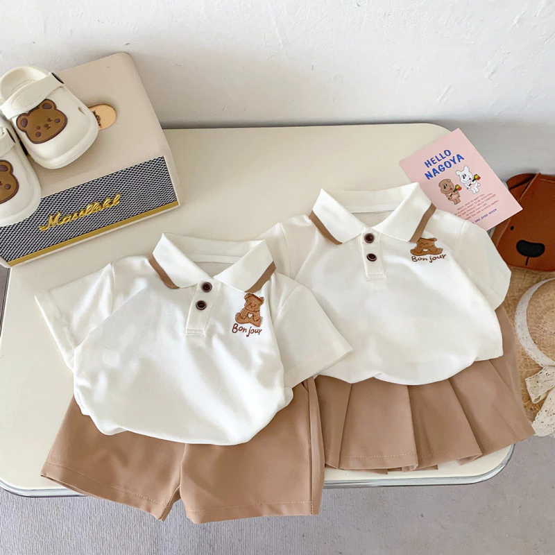 Nam Nữ Cho Bé Phong Cách Preppy Hoạt Hình Phù Hợp Với polo Váy Ngắn Tay 2026 Phong Cách Mới Phiên Bản Hàn Quốc Phong Cách Trường Đại Học Anh Em Gái Phù Hợp Với