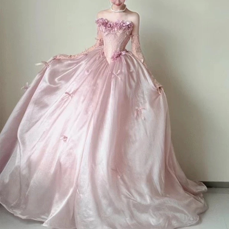Đầm Nữ Dài Hồng Phấn Phối Ren Hoa 3D Tùng Xòe Rộng Tay Rời Nơ Nhỏ