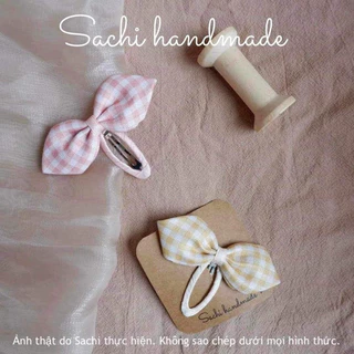 Kẹp mái nơ kẻ caro vàng, hồng handmade by Sachi