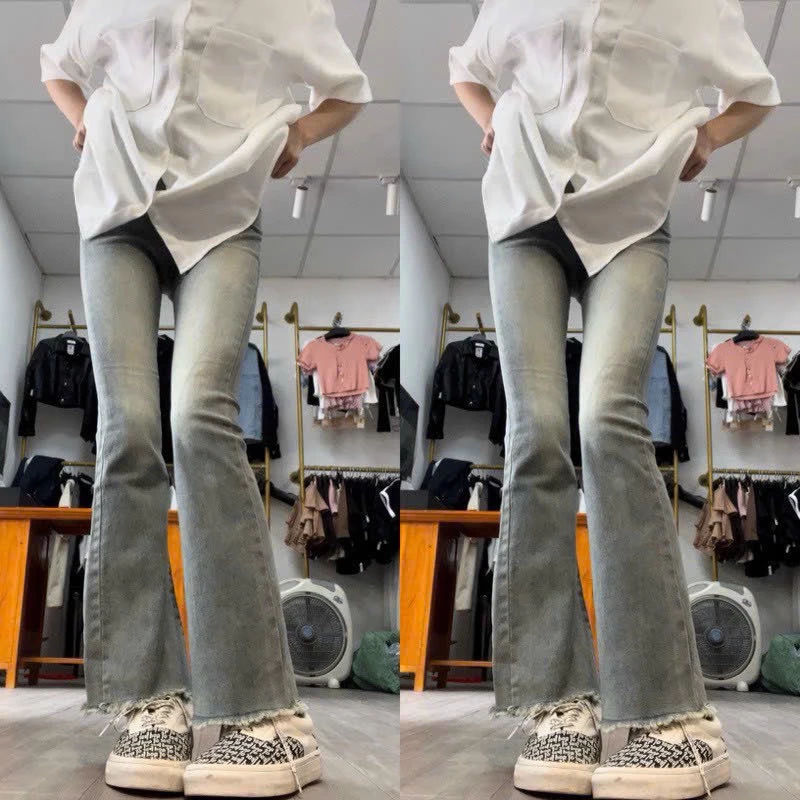 Quần jeans ống loe co giãn gấu tua rua dáng dài lưng cao phong cách Hàn Quốc