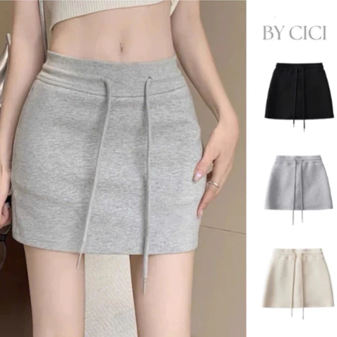 Váy ngắn ôm dáng chữ A cạp cao dây rút chất nỉ kèm quần bảo hộ cho nữ, thời trang và tiện lợi.