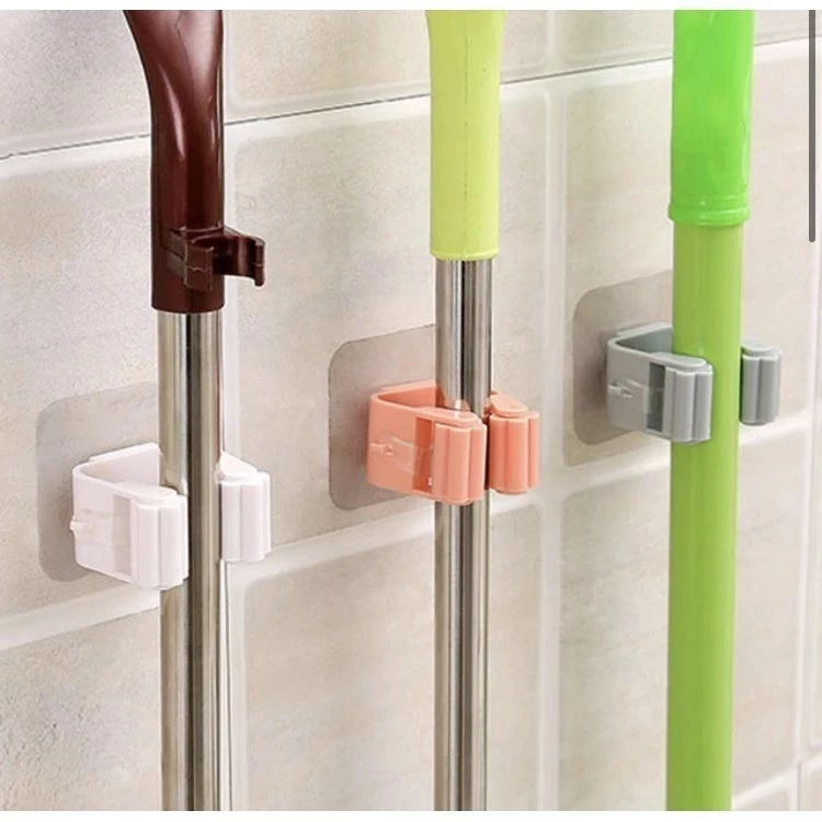 Móc dán tường giữ cây lau nhà / treo chổi chịu lực tốt không thấm nước .
