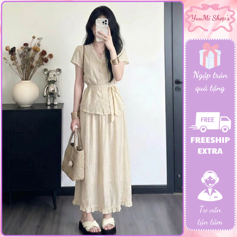 Set bộ nữ áo kiểu thêu hoa ren thắt nơ eo phối chân váy maxi suông dài màu trắng kem HCOM27141