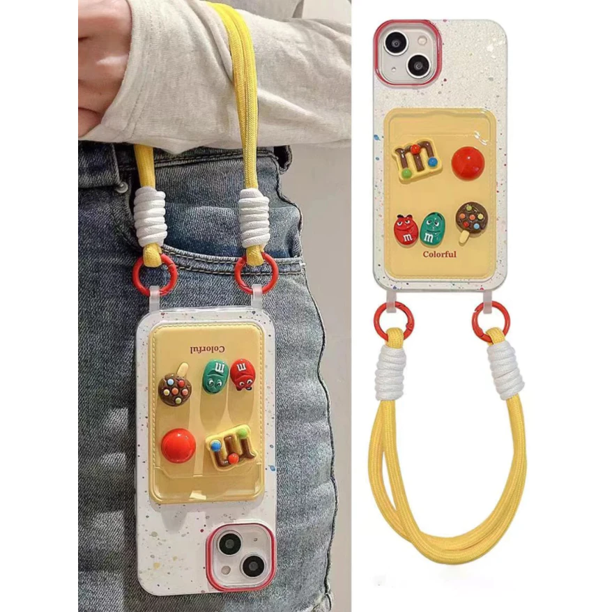 Ốp Lưng iPhone Kèm Dây Đeo Cổ Tay Hoạt Hình M&M 3D Chống Sốc Cho iPhone 11 12 13 14 15 16 Pro Max