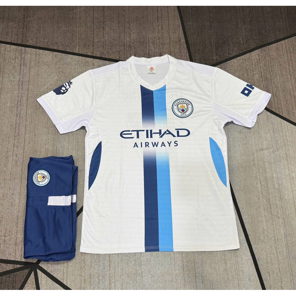 Bộ Quần Áo Đá Banh MC Trắng ĐK 2026 (Nhận In Tên Số) Thun Mè Cao Cấp Logo Thêu Nam Nữ Top Sport