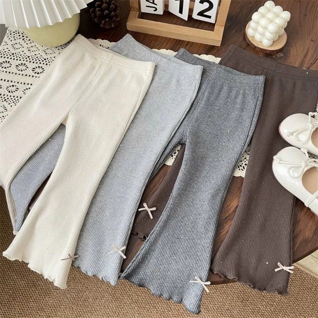 Quần legging ống loe đính nơ, quần dài thu đông xinh xắn chất liệu len tăm cho bé gái 8-18kg